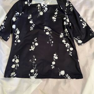Ann Taylor.  Black and white floral stretch top. Fitted. Never worn.